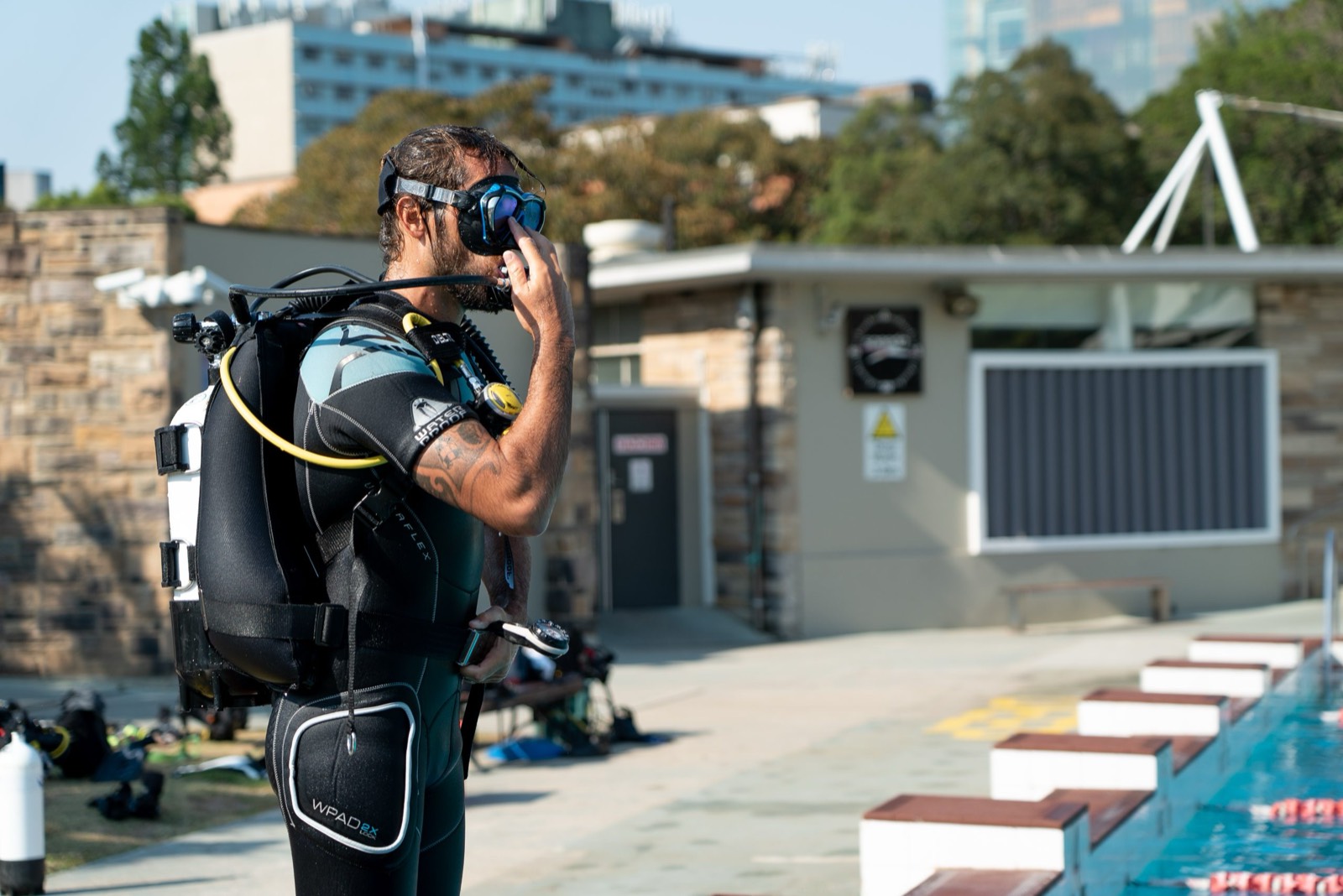 A diver preparing at the surface of the training pool
